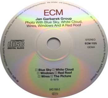 CD Jan Garbarek Group: Photo With Blue Sky, White Cloud, Wires, Windows And A Red Roof